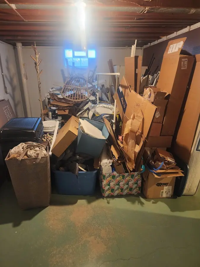 Roll-off dumpster container at job site for 15 Yard Dumpster Rental in Red Bay